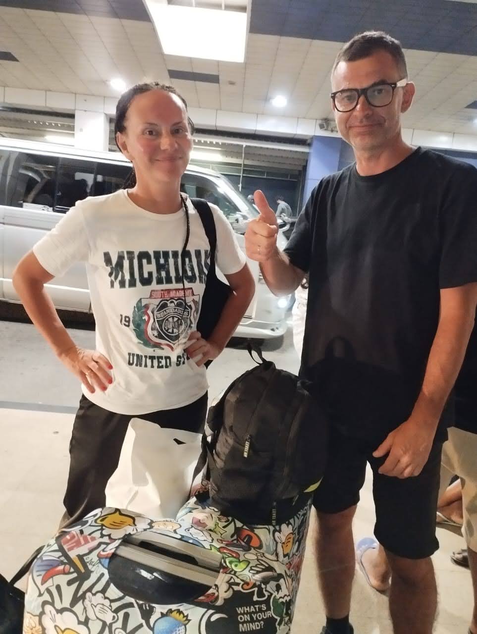 Late-night airport pickup, all smiles