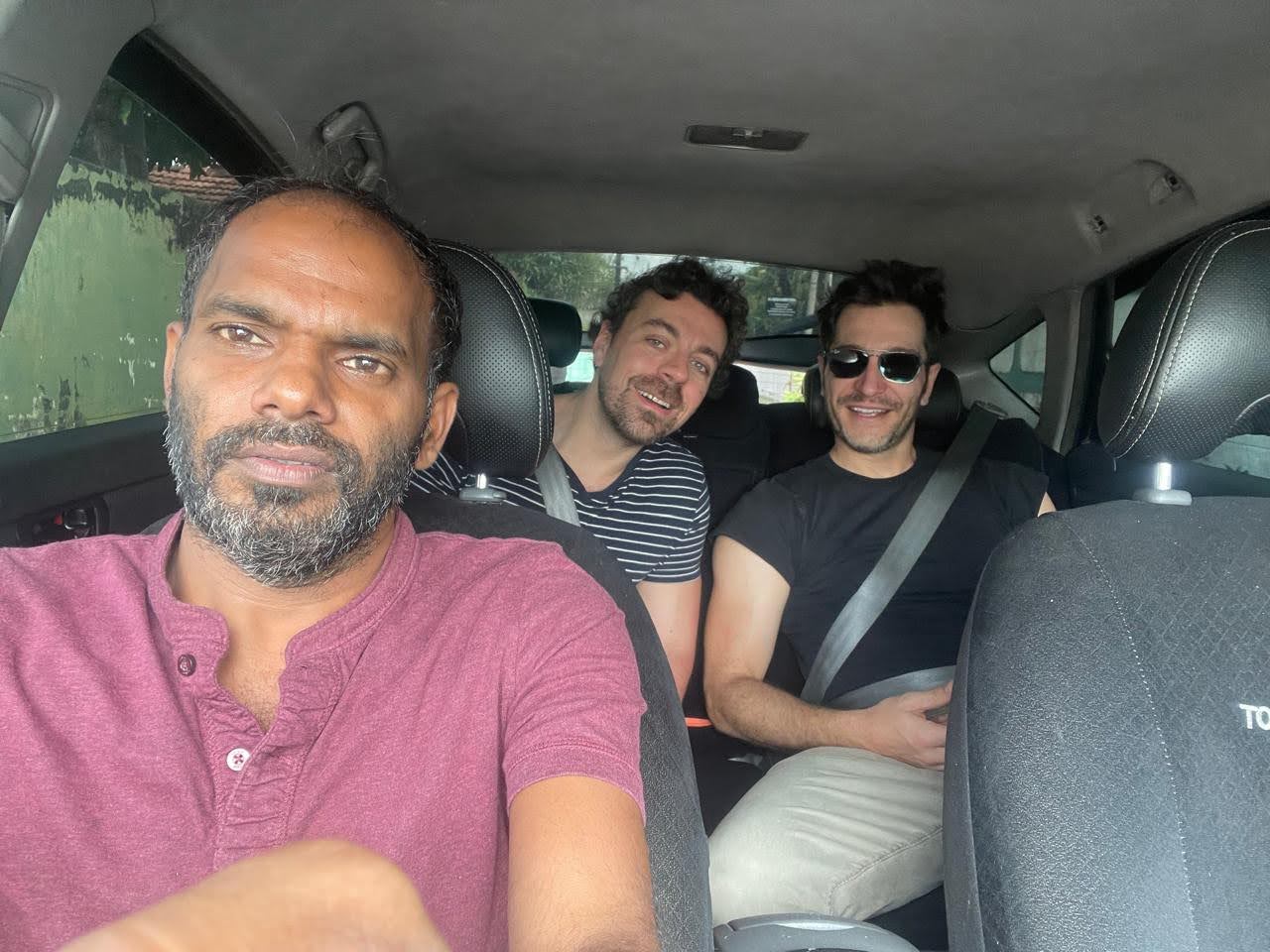 Friends on a private sedan tour with their chauffeur-guide
