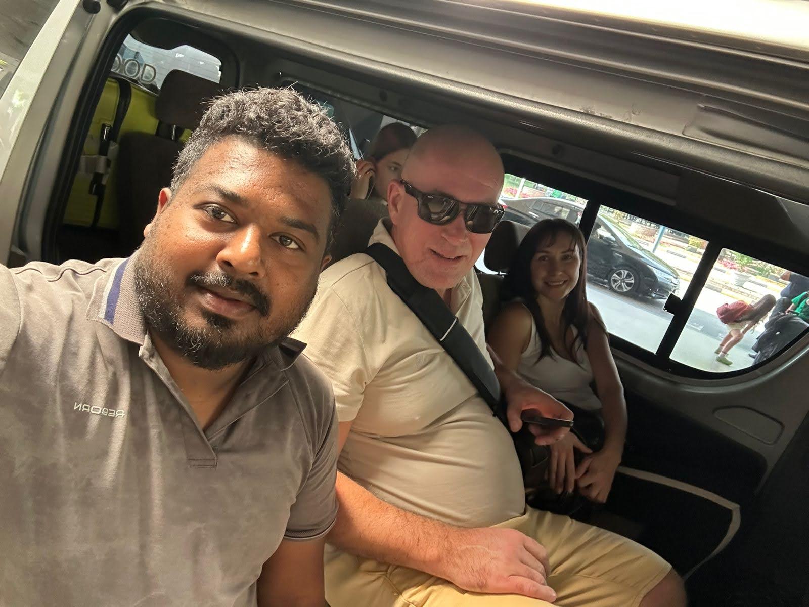 Airport pickup selfie — guests buckled in and ready